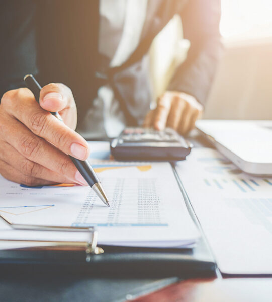 Business concept. Business people discussing the charts and graphs showing the results of their successful teamwork.